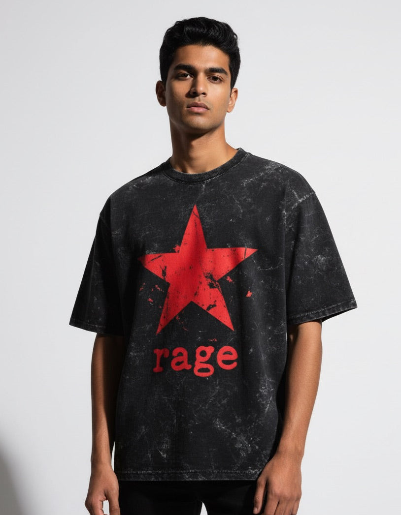 Person wearing a black t-shirt with a red star and 'rage' text on a plain background