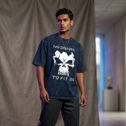 Person wearing a dark t-shirt with a skull design and text, standing in a room with a neutral background.
