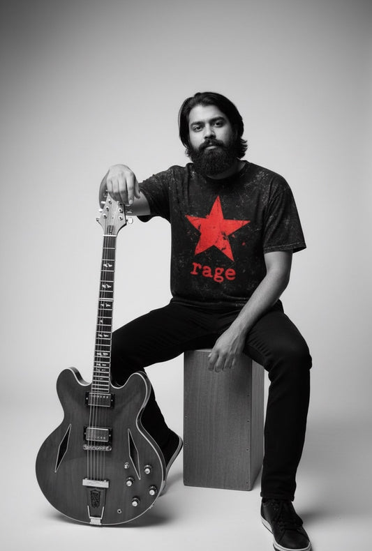 Person wearing a t-shirt with a red star and 'rage' text, holding a guitar.