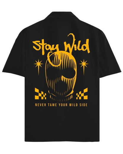 Black t-shirt with yellow graphic and text 'Stay Wild Never Tame Your Wild Side' on a white background