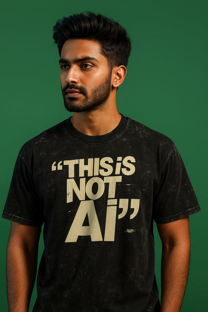 Man wearing a black t-shirt with 'THIS IS NOT AI' text on a green background