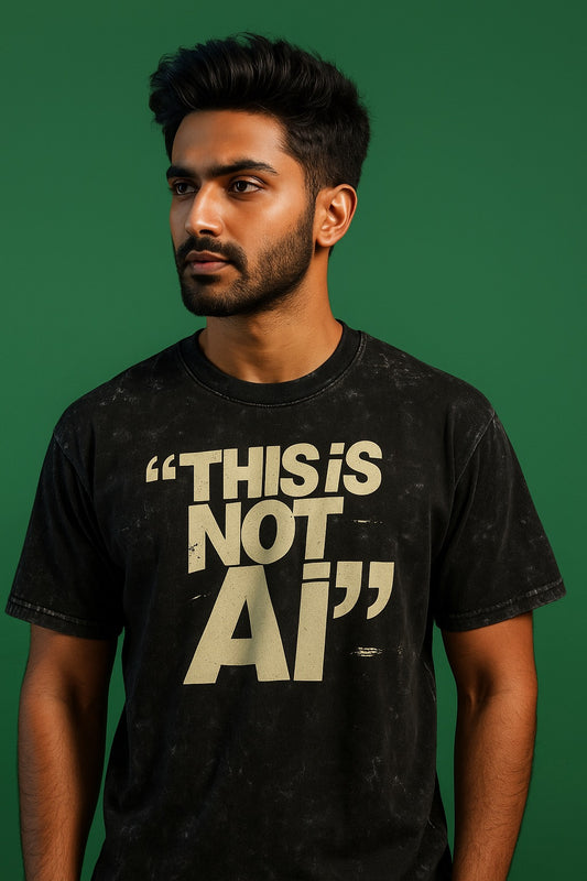 Man wearing a black t-shirt with 'THIS IS NOT AI' text on a green background
