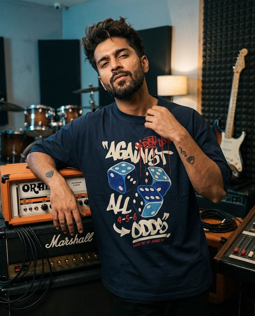 Man wearing a t-shirt with a graphic design in a music studio