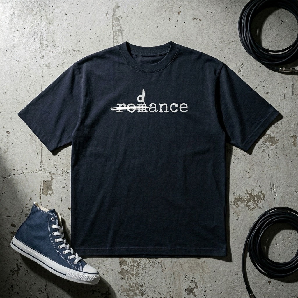 Drummerkong oversized dancer t-shirt with 'dance' text on a textured surface with a blue sneaker.