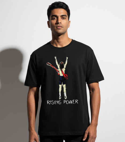 Man wearing a black t-shirt with a Rising Power graphic design and text on a plain background
