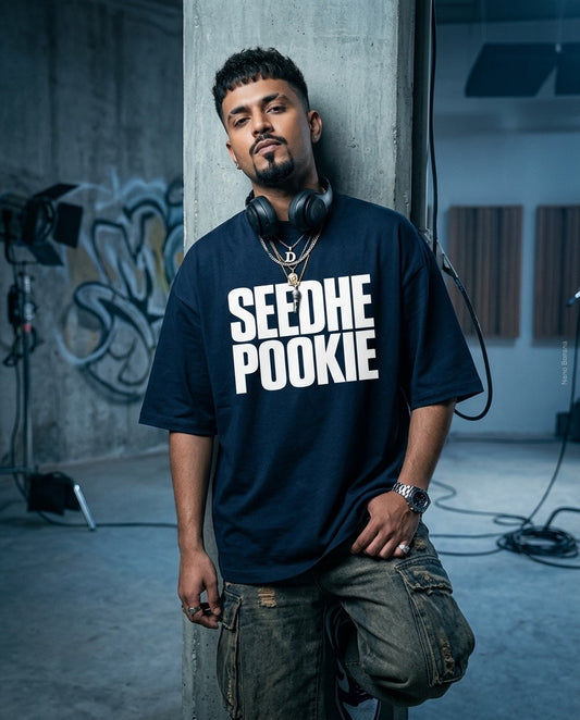 Man wearing a black t-shirt with 'SEEDHE POOKIE' text in a casual setting.